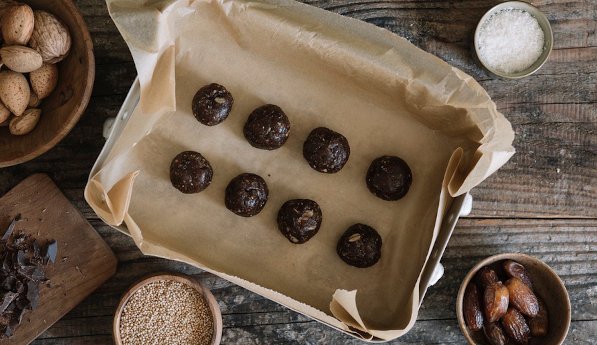 still life from above of raw energy balls with nuts