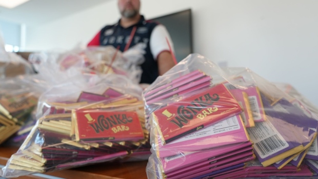 on the table are 22 000 worth of counterfeit willy wonka bars part of a haul seized on oxford street on monday